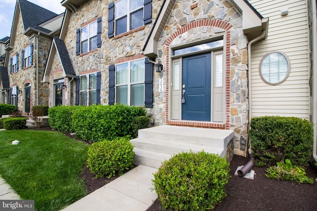 entrance to property with stone siding
