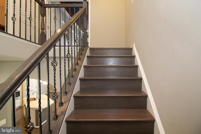 stairs featuring baseboards