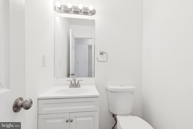bathroom with toilet and vanity