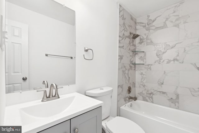 bathroom with vanity, toilet, and bathtub / shower combination