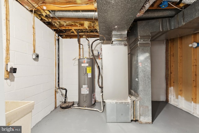 utility room featuring water heater and heating unit