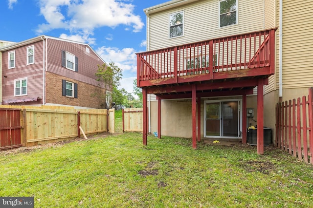 rear view of house with a deck and central AC unit
