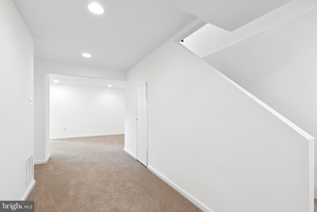 hall with recessed lighting, carpet, and baseboards