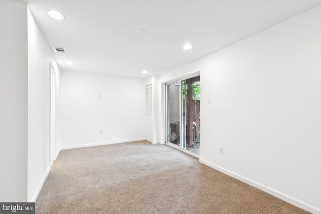 carpeted empty room with recessed lighting and baseboards
