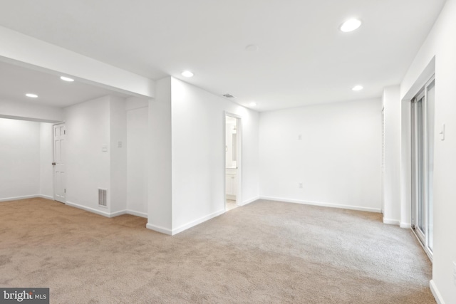 below grade area with recessed lighting, carpet, and baseboards