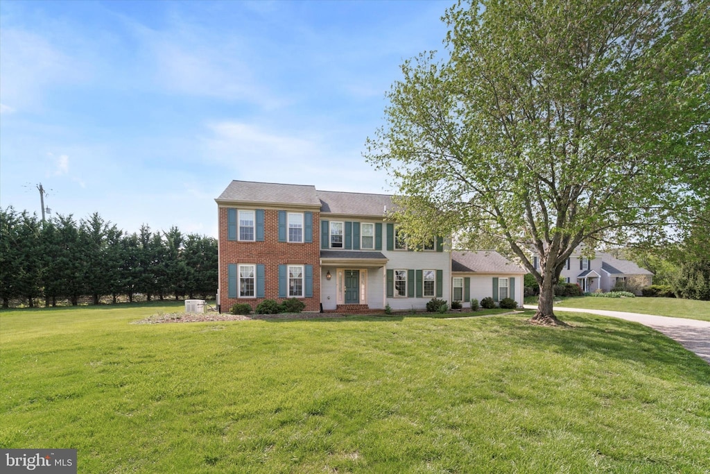 1098 Armstrong Ct, Chesterbrook, PA 19087 - colonial-style house featuring brick siding and a front yard
