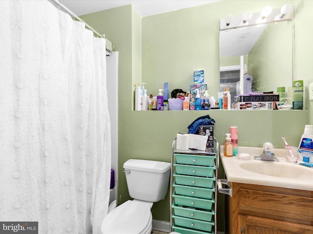 full bathroom with vanity, toilet, and a shower with shower curtain