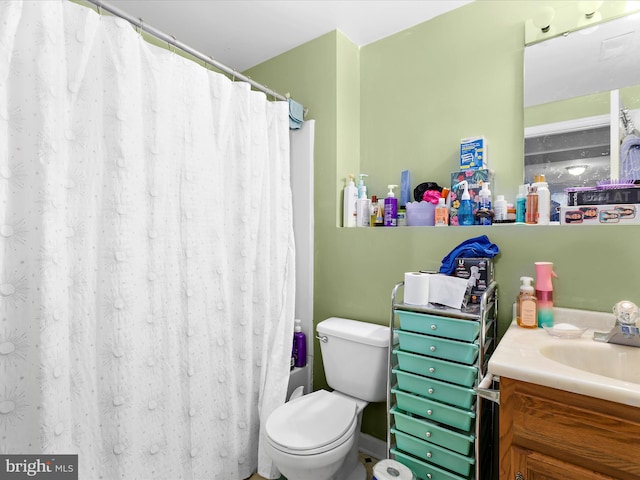 bathroom with vanity, a shower with curtain, and toilet