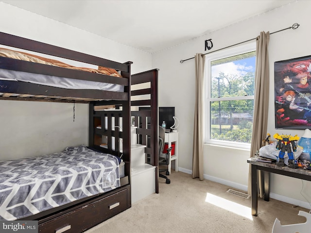 bedroom with carpet flooring, baseboards, and visible vents