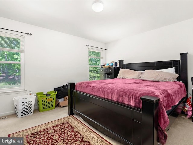 bedroom featuring carpet floors and visible vents