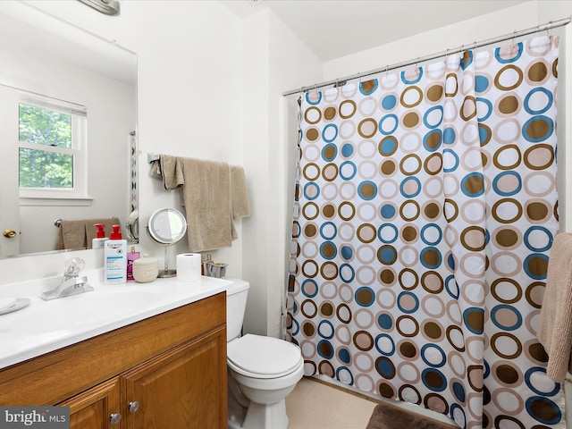 bathroom with vanity, toilet, and a shower with shower curtain