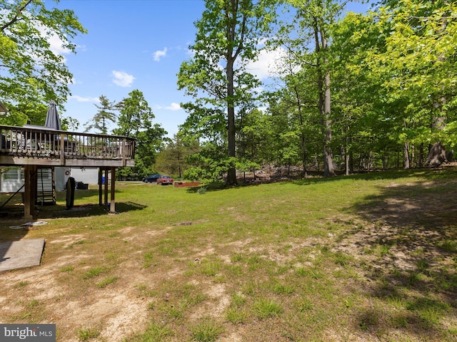 view of yard with a deck and stairway