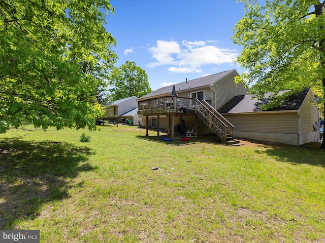 view of yard featuring a deck and stairway