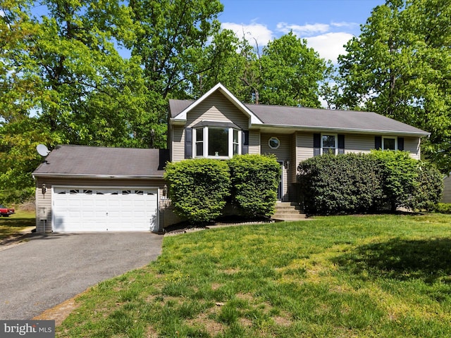 view of front of property featuring an attached garage, a front yard, and aphalt driveway