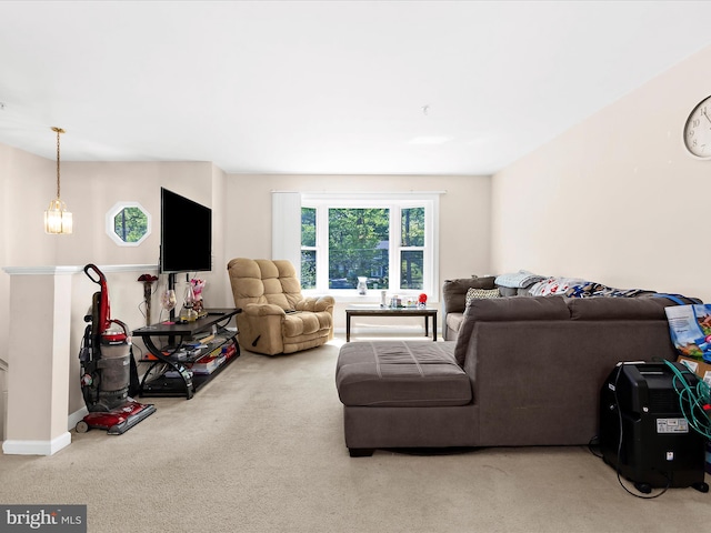 carpeted living area featuring baseboards