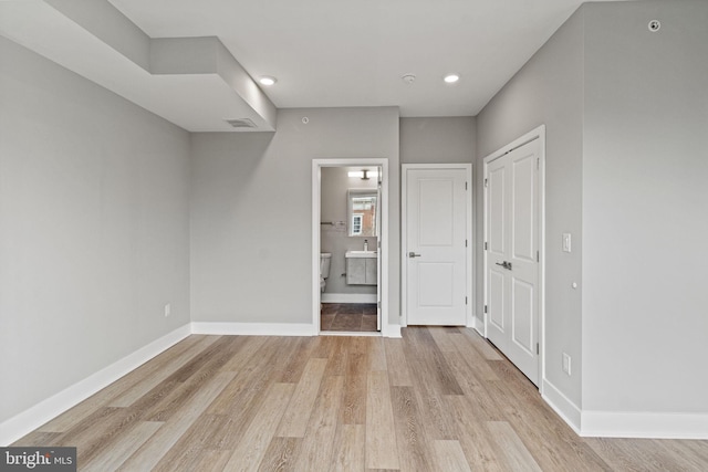 2114 N 8th St, Philadelphia, PA 19122 - unfurnished bedroom featuring light wood-type flooring, ensuite bath, recessed lighting, and a closet