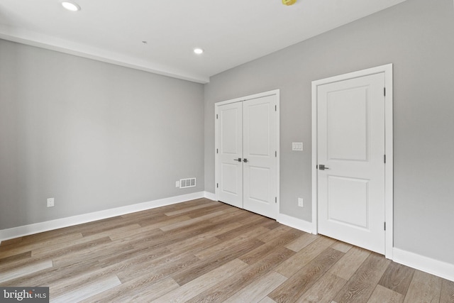 2114 N 8th St, Philadelphia, PA 19122 - unfurnished bedroom with light wood-type flooring, recessed lighting, and a closet