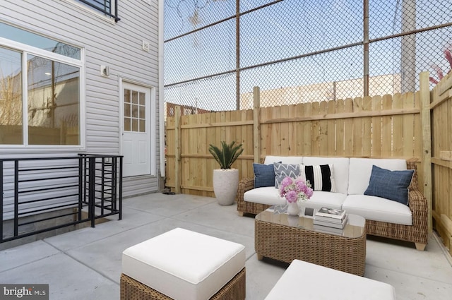 view of patio / terrace with fence and an outdoor living space