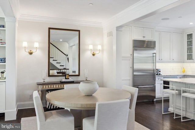 dining room with crown molding, visible vents, stairs, dark wood-type flooring, and recessed lighting
