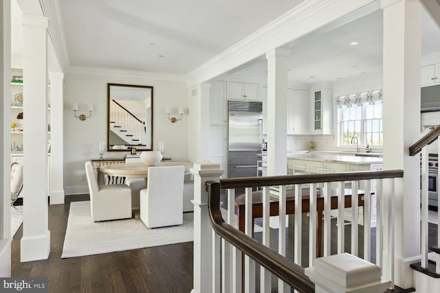 dining space with dark wood-style flooring, stairs, baseboards, decorative columns, and ornamental molding