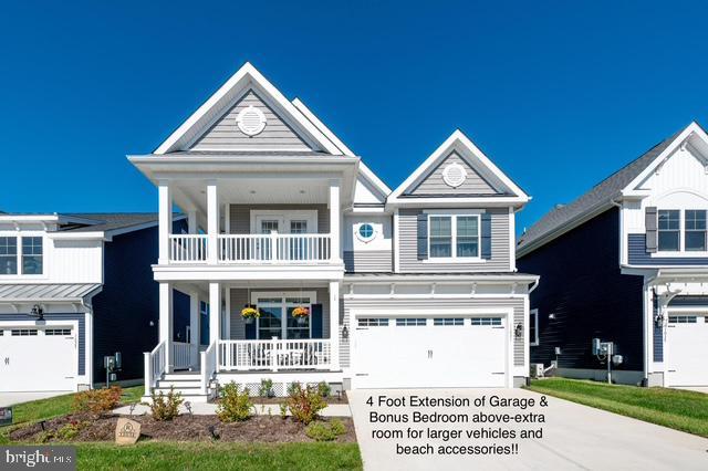 view of front of house with a garage, concrete driveway, a porch, and a balcony