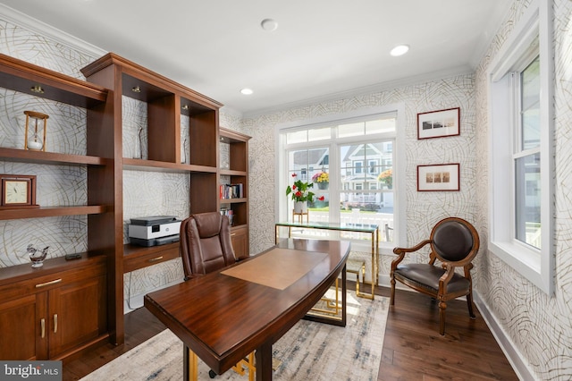 office space featuring crown molding, wallpapered walls, baseboards, and wood finished floors