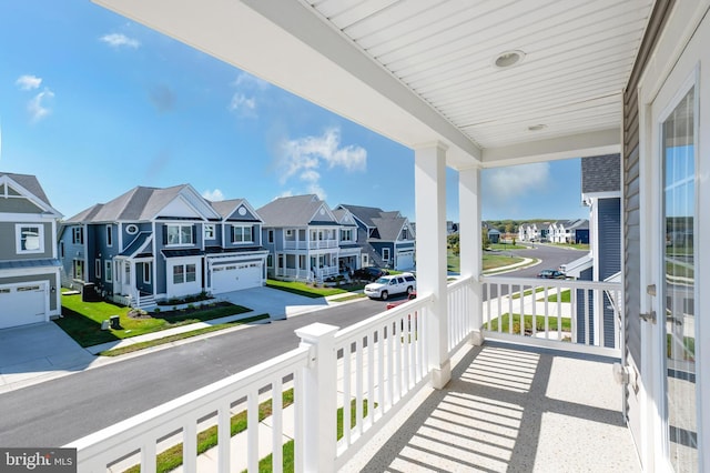 balcony featuring a residential view and covered porch