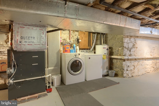 unfinished basement with heating unit, water heater, and washer and dryer