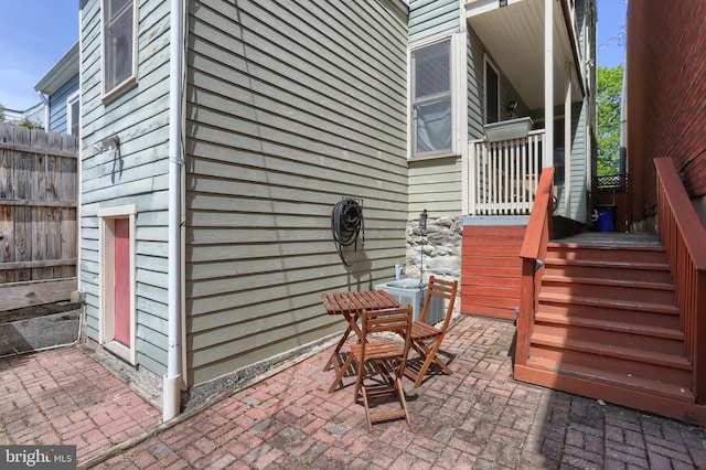 view of patio / terrace featuring fence