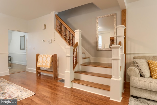 stairs with wood finished floors