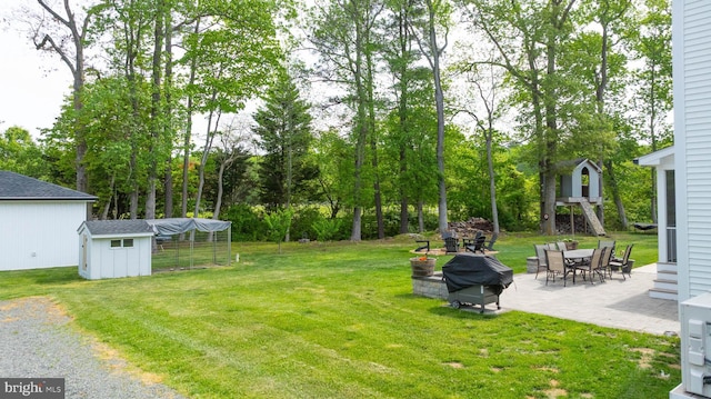 32991 Daisey Rd, Frankford, DE 19945 - view of yard featuring an outbuilding and a patio area