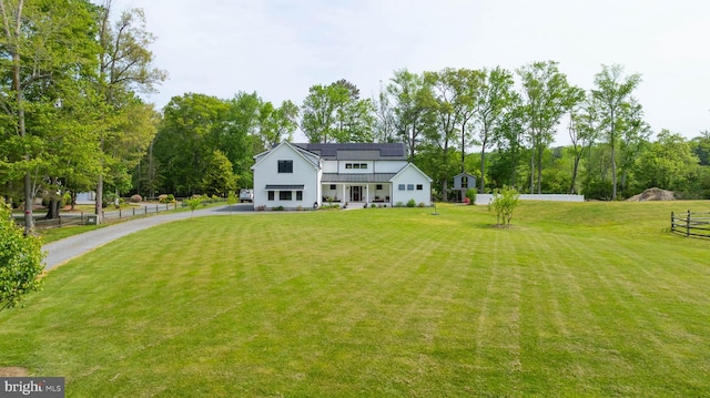 32991 Daisey Rd, Frankford, DE 19945 - rear view of property with driveway, metal roof, a standing seam roof, a lawn, and fence