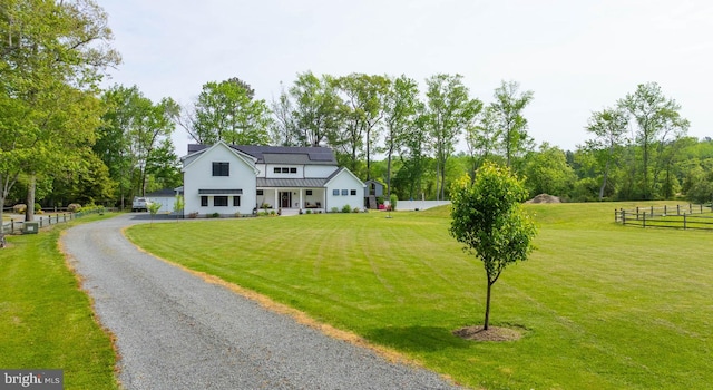 32991 Daisey Rd, Frankford, DE 19945 - view of front facade with fence, a front yard, a standing seam roof, metal roof, and driveway