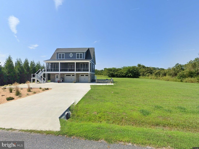 view of front of property with stairway, an attached garage, concrete driveway, and a front lawn