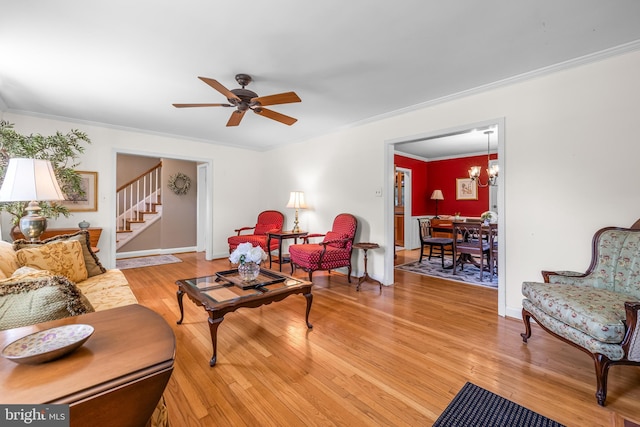2430 Stanwick Rd, Phoenix, MD 21131 - living area with ceiling fan, crown molding, stairway, baseboards, and light wood-style flooring
