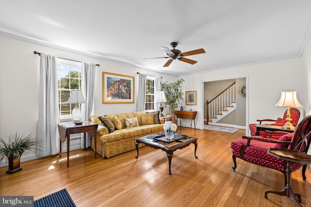 2430 Stanwick Rd, Phoenix, MD 21131 - living area featuring ornamental molding, stairs, baseboards, ceiling fan, and light wood-type flooring