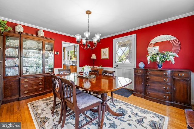 2430 Stanwick Rd, Phoenix, MD 21131 - dining room with crown molding, light wood-style flooring, and a notable chandelier