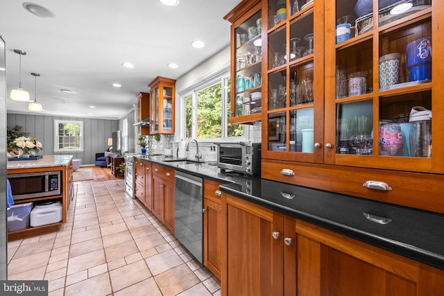 2430 Stanwick Rd, Phoenix, MD 21131 - kitchen featuring brown cabinetry, a sink, a wealth of natural light, and stainless steel appliances