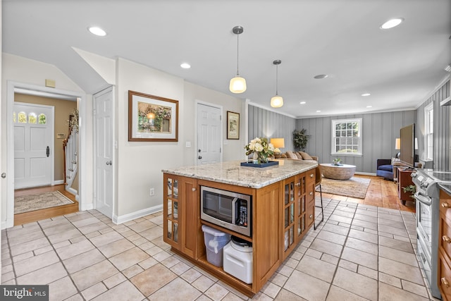 2430 Stanwick Rd, Phoenix, MD 21131 - kitchen featuring brown cabinets, stainless steel appliances, open floor plan, baseboards, and glass insert cabinets