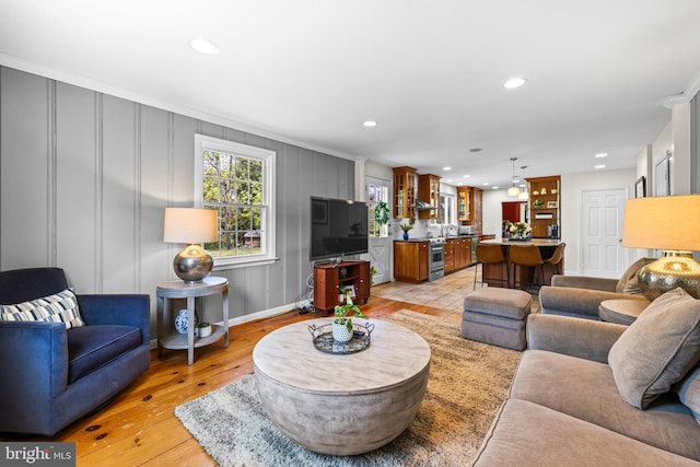 2430 Stanwick Rd, Phoenix, MD 21131 - living room featuring crown molding, recessed lighting, and light wood-style flooring