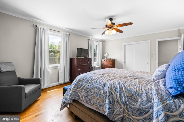 2430 Stanwick Rd, Phoenix, MD 21131 - bedroom with a ceiling fan, crown molding, wood finished floors, baseboards, and a closet
