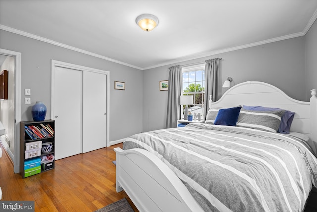 2430 Stanwick Rd, Phoenix, MD 21131 - bedroom featuring crown molding, wood finished floors, and a closet