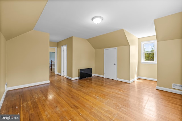 2430 Stanwick Rd, Phoenix, MD 21131 - bonus room with baseboards, light wood-style flooring, and lofted ceiling