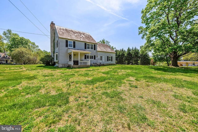 2430 Stanwick Rd, Phoenix, MD 21131 - back of house featuring a lawn and a chimney
