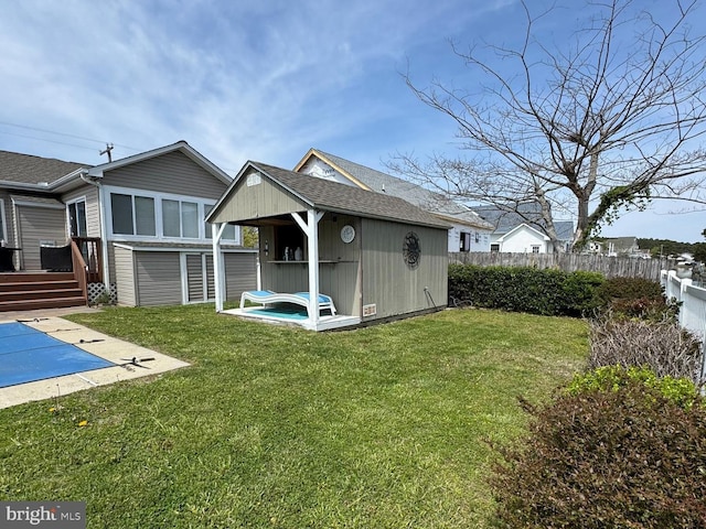10350 Keyser Point Rd, Ocean City, MD 21842 - back of property with a shed, an outdoor structure, a deck, and a shingled roof