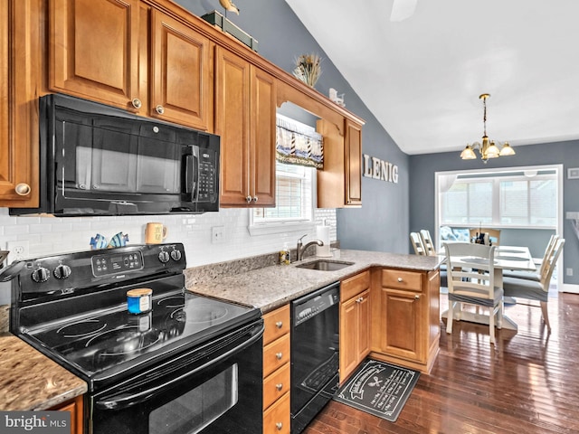 10350 Keyser Point Rd, Ocean City, MD 21842 - kitchen with black appliances, lofted ceiling, a sink, decorative backsplash, and brown cabinets