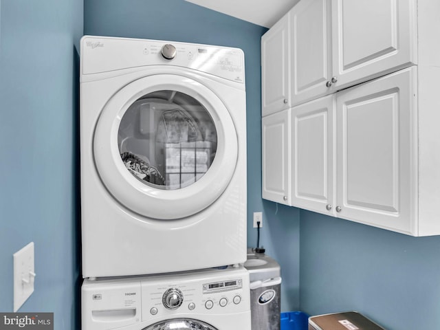 10350 Keyser Point Rd, Ocean City, MD 21842 - washroom with cabinet space and stacked washer / dryer