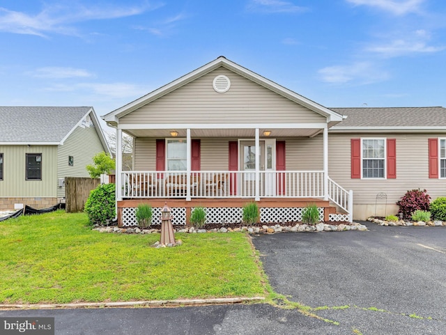 10350 Keyser Point Rd, Ocean City, MD 21842 - view of front of house featuring covered porch and a front lawn