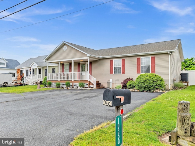 10350 Keyser Point Rd, Ocean City, MD 21842 - single story home with covered porch and a front lawn