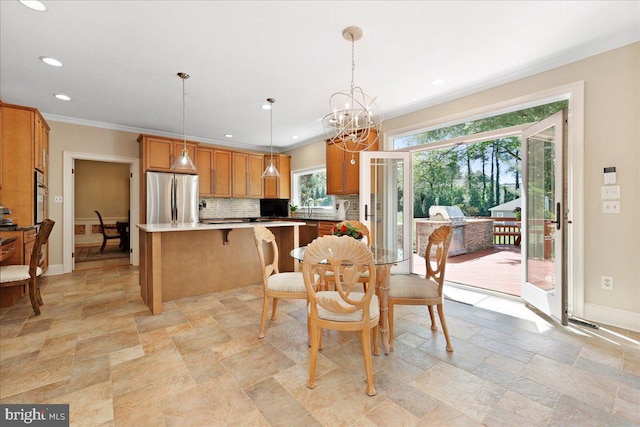 dining area with stone tile flooring, ornamental molding, an inviting chandelier, baseboards, and recessed lighting